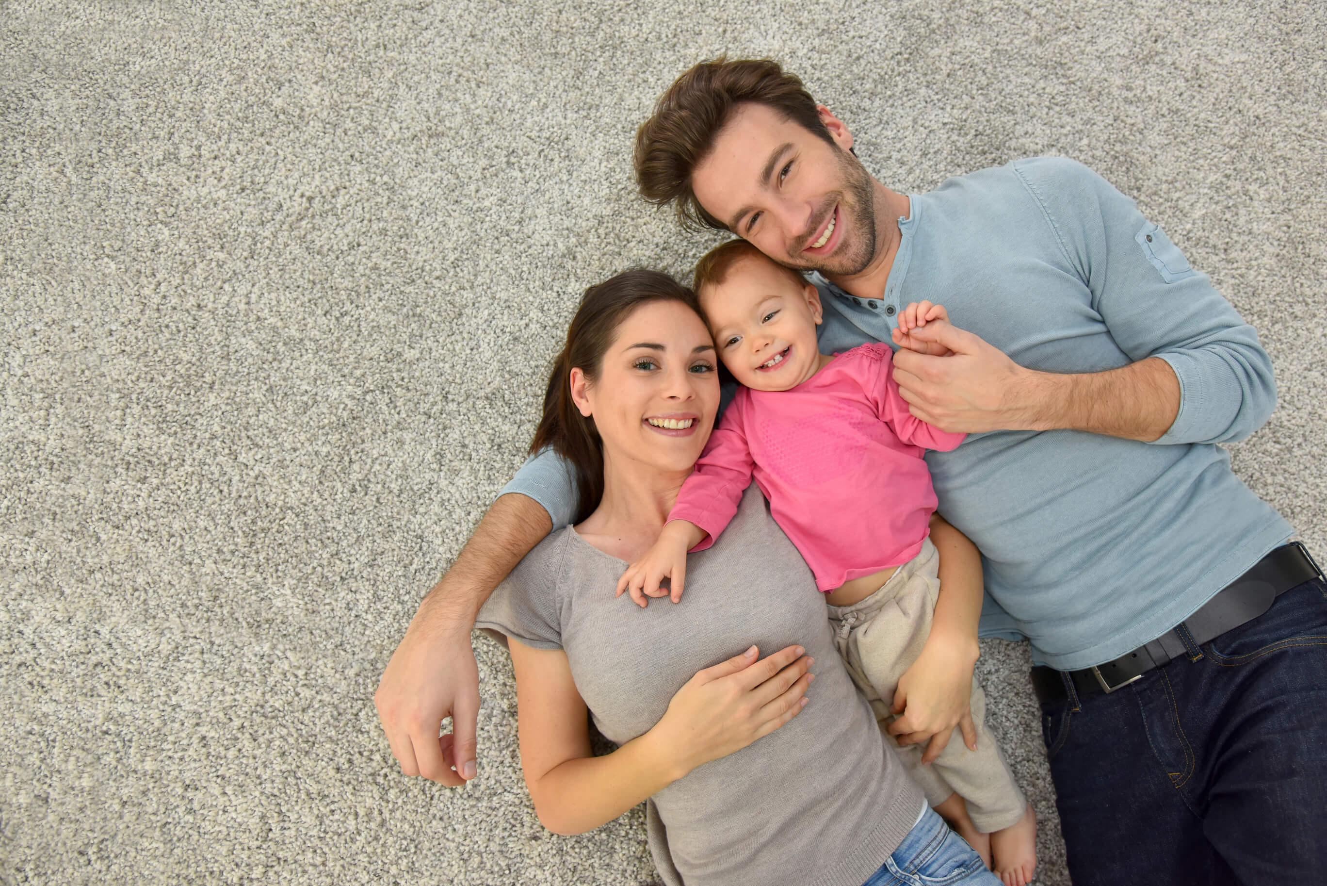 Family laying on clean carpet